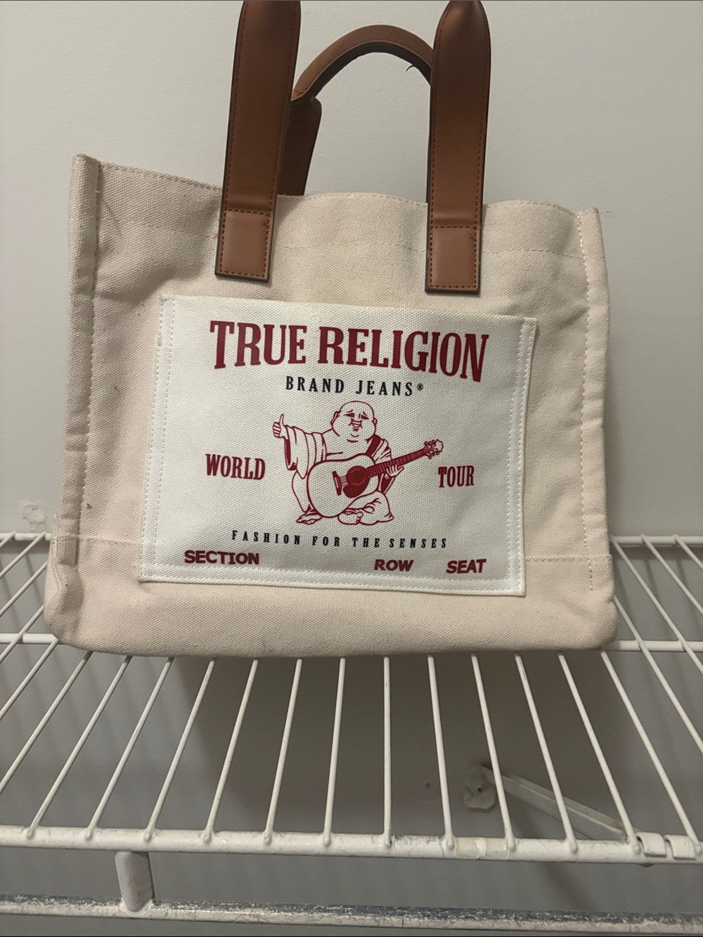 True Religion Cream Canvas Tote with Brown Handles and Red Logo